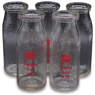 Five Vintage Meadow Gold Milk Bottles