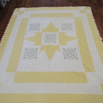 Embroidered hand quilted quilt