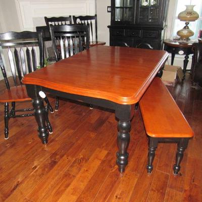 Dining table with 4 chairs (plus 1) and bench.  There is also a leaf included