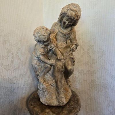 Many statues on pedestals