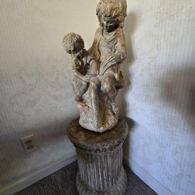 many statues on pedestals