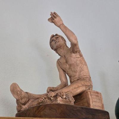 Many statues on pedestals