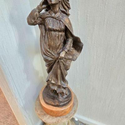 many statues on pedestals