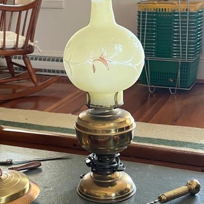 Antique converted oil lamp with yellow satin glass globe
