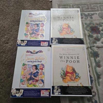 #60058 • 4 Disney Exclusive Deluxe Video Edition of Snow White and Winnie the Pooh
