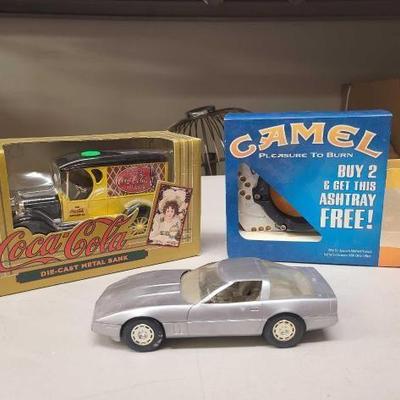 #1526 • Coca-Cola Die Cast Metal Bank, Model Corvette, and Camel Ashtray

