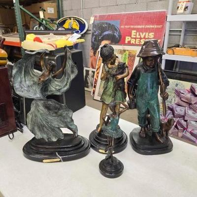 #1634 • 4 Bronze Statues
