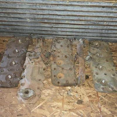 #2306 • (3) Ford Flathead V8 Heads, (1) Intake Manifold, and (1) Exhaust Manifold
