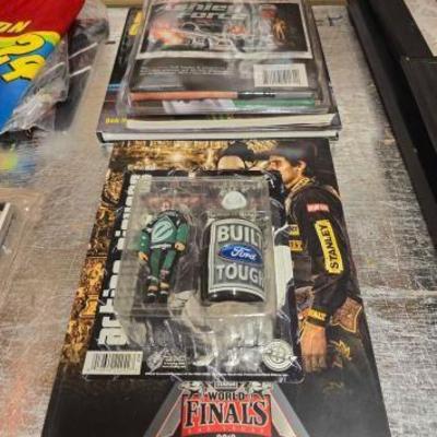 #20746 • PBR Rodeo clown toy , PBR book & Nascar books, banner
