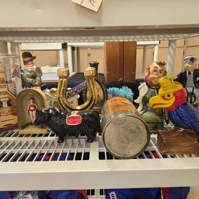 #50288 • 11 Decanters and 1 Large Decorative Bottle
