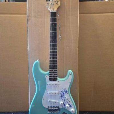#10524 • The Osmonds Autographed Electric Fender Squier Guitar

