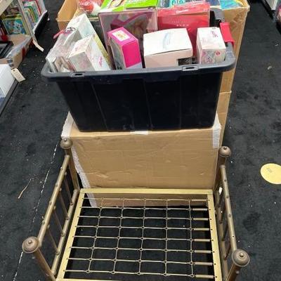 #10172 • 1 Tote 1 Box of Dolls and Baby Doll Bed frame
