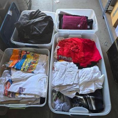 #12086 • (4) Totes of Shirts and Sweaters
