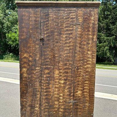 An 1800's Painted Grain Primitive Cabinet