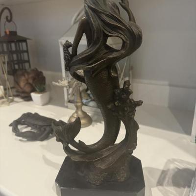 Signed bronze statues