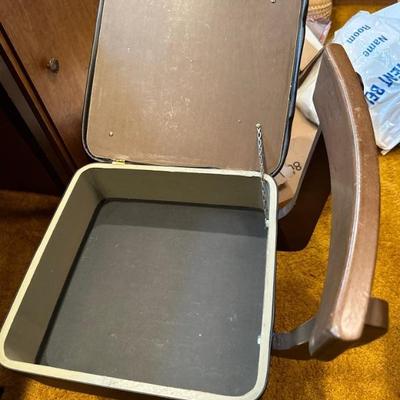 Chair has storage under the seat (open)