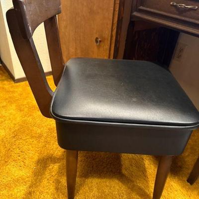 Chair has storage under the seat (closed)