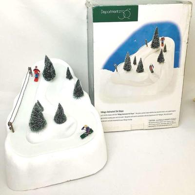 GRLI603 Dept. 56 Village Animated Ski Slope	Dept 56 village animated ski slope comes with original box, two downhill skiers, tow rope,...