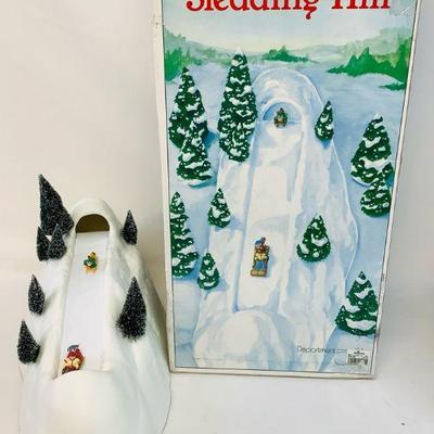 GRLI604 Dept 56 Village Animated Sledding Hill	This Dept 56 village animated sledding hill set comes with the original box and...
