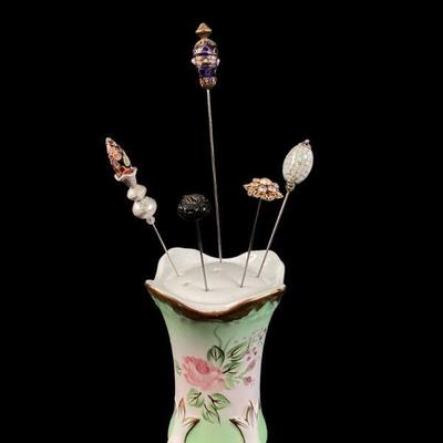 GRLI713 Antique Hat Pins In Limoges Cup	Porcelain Limoges hat pin cup with 5 pins, made of glass, mother of pearl, rhinestones, glass...
