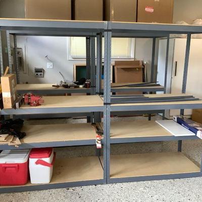 GRLI212 Metal Storage Shelving #1	A pair of grey metal shelves with a few extra metal pieces. Metal pieces are thin and come with wood...