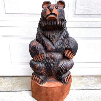 GRLI205 Wood Carving Bear	Hand carved wooden bear with looks to be glass eyes.
