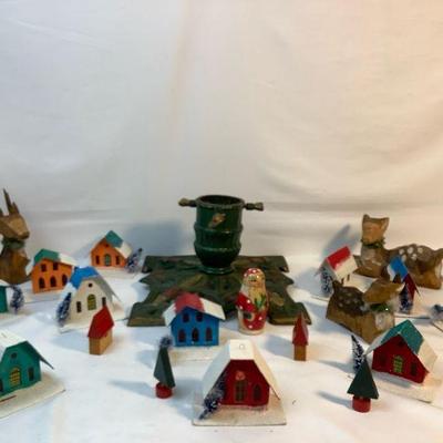BEDO339 Vintage Cast Iron Tree Stand & Ornaments	The tree stand is cast iron.  There are 11 house ornaments made in Japan.  The...