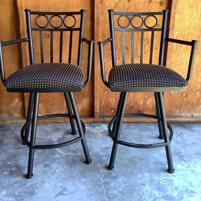 BIGA327 Two Wrought Iron Swivel Bar Stools	Black wrought iron with black and gold fabric seats.   Bar stools are approximately 40"...