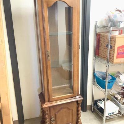 MAGR800 Wood Curio Cabinet	Solid wood curio cabinet with glass shelves and ceiling light. Measures approximately 68" tall by...