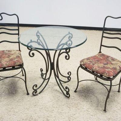 1167	BISTRO SET, 2 IRON CHAIRS WITH APPROXIMATELY 30 IN X 32 IN GLASS TOP TABLE WITH IRON BASE
