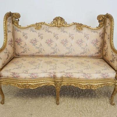 1117	ORNATE GILT WOOD UPHOLSTERED FRENCH SETEE WITH CARVING ALL OVER AND FLORAL BASKET URN CENTER CREST, APPROXIMATELY 86 IN X 22 IN X 44...