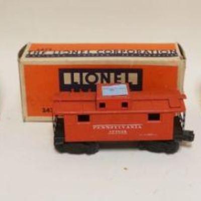1284	LIONEL O GAUGE TRAIN NO 6472 REFRIGERATOR CAR, NO 2472 CABOOSE, NO 2411 FLAT CAR
