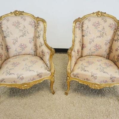1118	PAIR OF ORNATE GILT WOOD UPHOLSTERED FRENCH ARM CHAIRS WITH SCROLLED AND SHELL CARVED CREST, EACH APPROXIMATELY 29 IN X 24 IN X 40...
