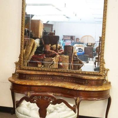 1112	MASSIVE FRENCH MAHOGANY STEP BACK BROWN TOP, 3 DRAWER VANITY WITH ORNATE GILT EDGE MIRROR AND TUFTED BENCH, MARBLE HAS CRACKS,...