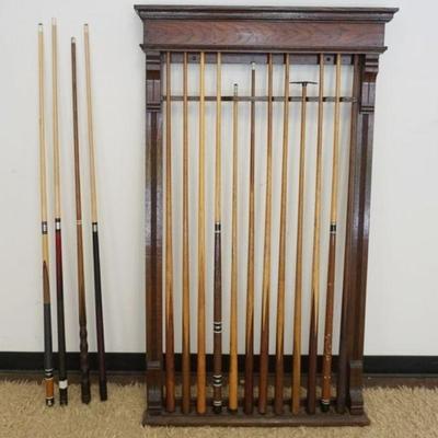 1202	OAK POOL STICK WALL RACK WITH 11 CUE STICKS
