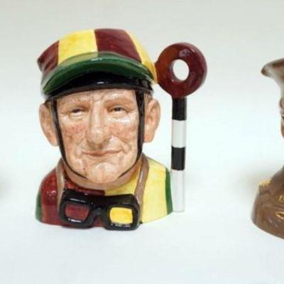 1014	3 ROYAL DOULTON TOBIES, MONTY, JOCKEY, GLENN MILLER, TALLEST APPROXIMATELY 8 1/2 IN
