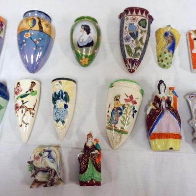 1034	GROUP OF 14 ASSORTED POTTERY FLORAL WALL POCKETS
