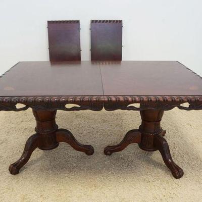 1159	MAHOGANY DINING ROOM TABLE WITH QUARTER SHELL INLAY ON TOP AND 2 LEAVES, APPROXIMATELY 66 IN X 44 IN X 31 IN H, LEAVES EACH 18 IN
