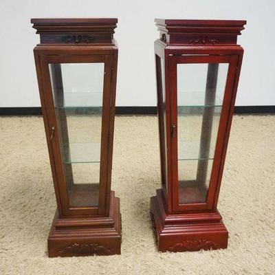 1165	2 PYRAMID SHAPED PEDESTALS WITH 1 DOOR CENTER DISPLAY, EACH HAVING 2 GLASS SHELVES, APPROXIMATELY 13 IN SQUARE X 42 IN H
