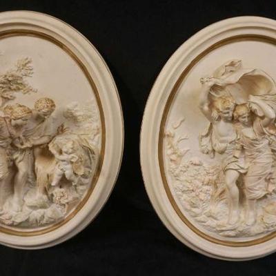 1002	PAIR OF ITALIAN OVAL PLASTER WALL PLAQUES, 3 DIMENTIONAL, DEPICTING CLASSICAL SCENES, EACH APPROXIMATELY 17 IN X 13 IN
