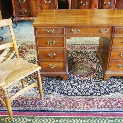 1179	SOLID CHERRY STICKLEY 8 DRAWER DESK WITH RUSH SEAT CHAIR, DESK APPROXIMATELY 48 IN X 25 IN X 31 IN H

