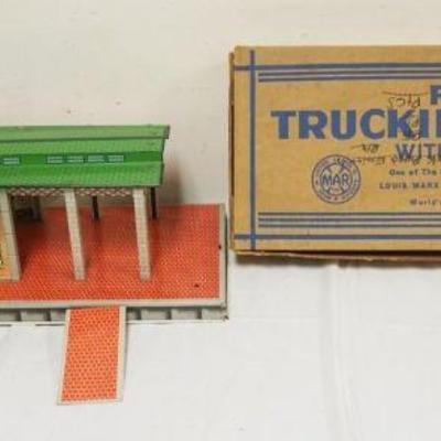 1249	MARX TIN FREIGHT TRUCKING TERMINAL W/BOX, TERMINAL APPROXIMATELY 11 IN X 29 IN X 9 IN HIGH
