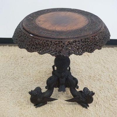 1121	ANTIQUE PIERCED AND FRETWORK CARVED ASIAN TABLE WITH WINGED GRIFFINS ON BASE, APPROXIMATELY 29 IN X 30 IN, 1 WING MISSING
