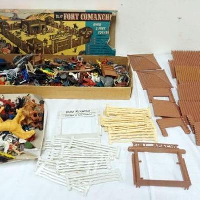 1254	HUGE ASSORTMENT OF VINTAGE TOY FIGUES, INCLUDING PLASTIC COWBOYS AND INDIANS AND HORSE TOYS WITH ASSORTED OUT BUILDINGS
