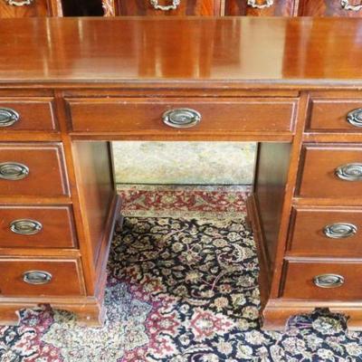 1180	MAHOGANY 9 DRAWER STUDENTS DESK, APPROXIMATELY 44 IN X 22 IN X 30 IN H
