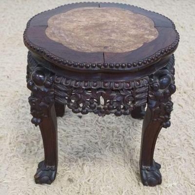 1127	ORNATE ANTIQUE ASIAN PIERCED CARVED TABLE WITH INSET BROWN MARBLE TOP, BALL AND CLAW FEET, APPROXIMATELY 15 IN X 16 IN
