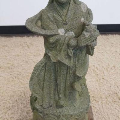 1123	STONE CARVED ASIAN FIGURE, APPROXIMATELY 12 IN X 12 IN X 34 IN
