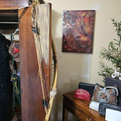 Prada purse, replica Navajo bow, armoire, 
