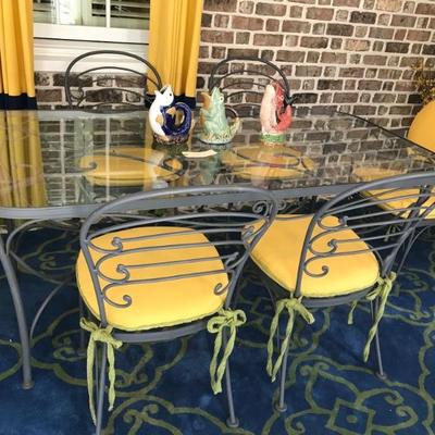 glass and cast iron table and set of 6 chairs with custom cushions $1,200
75 X 36 X 29