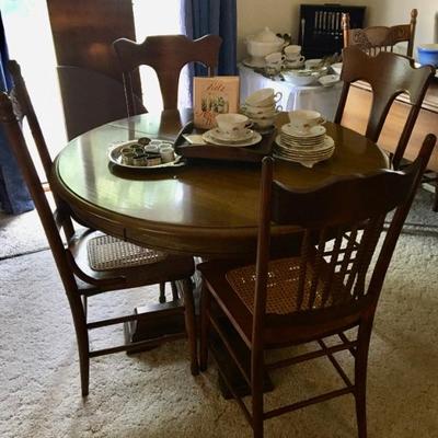 Round (Oval w/ Leaf) Pedestal Dinette Table & 4 Cane-Seat Chairs (6 available, one needs new piece of caning)